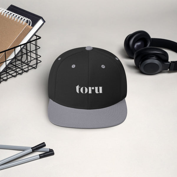 The toru Snapback Hat