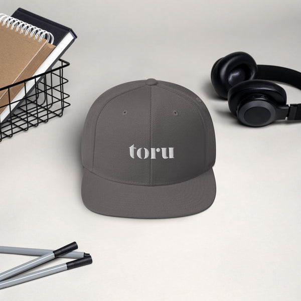 The toru Snapback Hat