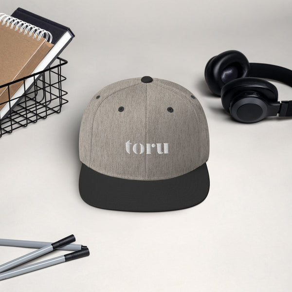 The toru Snapback Hat